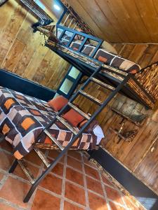 a bedroom with two bunk beds in a attic at Cabañas Tierra Fértil #2 