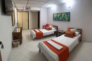 Postel nebo postele na pokoji v ubytování Hotel Sulicam