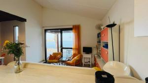 a living room with a view of the ocean at Appartement Solane 2 LUMIO in Lumio