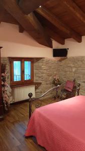 Posteľ alebo postele v izbe v ubytovaní Agriturismo Ca' de' Magnani