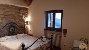 Posteľ alebo postele v izbe v ubytovaní Agriturismo Ca' de' Magnani
