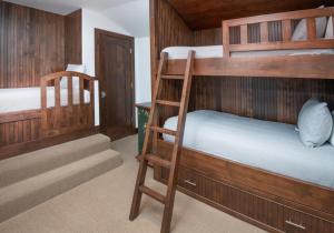 two bunk beds in a room with a staircase at Wildflower Place Unit 5 in Edwards +31 photos