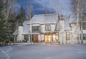 a white house with snow on the ground at Wildflower Place Unit 5 in Edwards