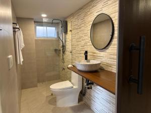 a bathroom with a sink and a toilet and a mirror at Luxury Thai Escape in Chiang Mai +11 photos