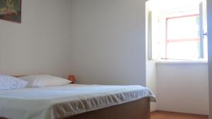 Postel nebo postele na pokoji v ubytování Vacation home Marinići