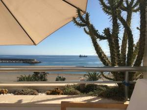 a view of the beach from the balcony of a resort at Ático en Parque Natural Cabo de Gata in Carboneras +22 photos