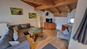 TV a/nebo společenská místnost v ubytování Hotel Ferienhaus Fux