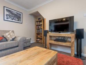 a living room with a couch and a flat screen tv at 3 Bed in Gosforth SZ064 in Gosforth