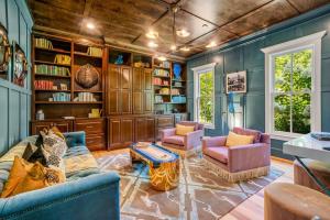 a living room with a couch and two chairs and a table at Luxury Mountain Mansion, 7BR, 8 king beds, 10000sf, Views, Pool, Sport Court, Gym, Sauna, Petting Zoo in Blue Ridge