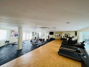 a gym with treadmills and elliptical machines at Golden Tulip Ibadan in Ibadan