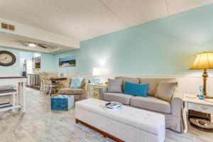 a living room with a couch and a table at Central Mary Esther Condo 5 Mi to Okaloosa Island! in Mary Esther
