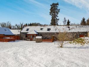 a stone barn with snow on the ground at 3 Bed in Huntly 57368 in Insch