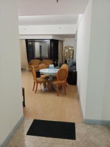 a dining room with a table and chairs at BBS APARTMENT AT TIMES SQUARE KUALA LUMPUR MALAYSIA in Kuala Lumpur