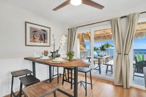 a dining room with a table and a view of the ocean at Beach Condo - Hollywood Beachfront and Broadwalk in Hollywood