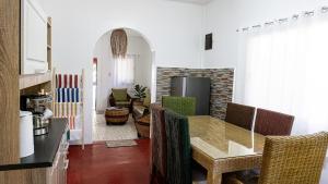 a dining room with a table and some chairs at EspIliNorte, Stay and Play in San Juan