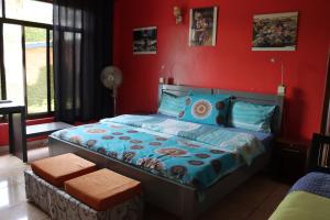 מיטה או מיטות בחדר ב-Umusambi B&B