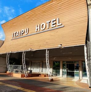 a happy hotel sign on the front of a building at Itaipu Hotel in Foz do Iguaçu