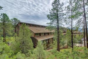 an exterior view of a house in the woods at The Lodge at Tamarron #425 in Durango