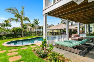 a backyard with a swimming pool and a house at 4BR Poipu Home with Private Pool- Alekona Kauai in Koloa