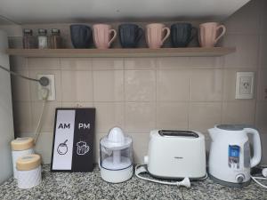 a kitchen counter with appliances on a counter top at LUAMAR 2-SAINT MICHELE in Mar del Plata