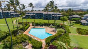 an aerial view of a resort with a swimming pool at Prime Oceanfront Condo near Shipwreck Beach - Alekona Kauai in Koloa