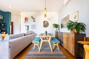 a living room with a couch and a table at Seabreeze Retreat with terrace - St Julians in St Julian's