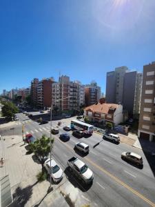 a city with cars parked on a street with buildings at LUAMAR 2-SAINT MICHELE in Mar del Plata