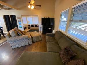 a living room with a couch and two chairs at The Overlook~Bandera, TX in Bandera