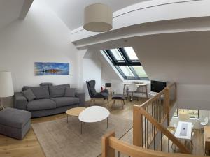 a living room with a couch and a table at Tor zum Meer in Helgoland