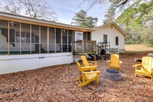 a group of chairs sitting outside of a house at Augusta 5bd: 10min to Golf Course - BBQ Grill in Augusta