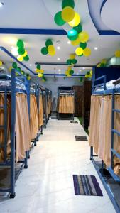 a row of clothes racks in a dressing room at Laxmi Dormitory in Vrindāvan