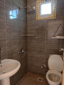 a bathroom with a toilet and a sink at Studio with a spacious garden in Al-Assla in Dahab