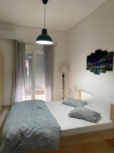 Postel nebo postele na pokoji v ubytování Nefeli Β1 apartment