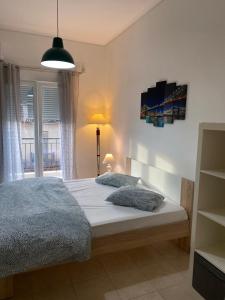 a bedroom with a bed and a window at Nefeli Β1 apartment in Thiva