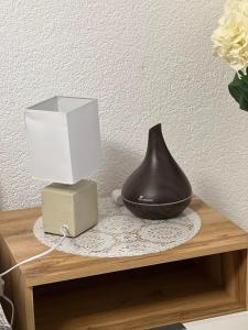 a vase and a box on a table at PETRA in Ðakovo