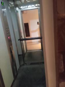 an escalator leading up to an elevator in a building at tranquil harmony in Casablanca