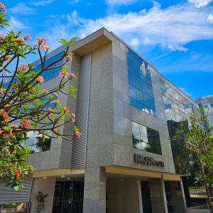 a building with a sign on the side of it at Naoum Hotel in Brasilia