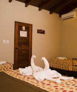 En eller flere senge i et værelse på Munay Hotel Cafayate