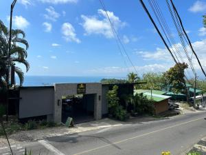 a building on the side of a road at Casa Mar in Manuel Antonio