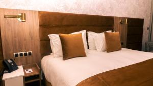Letto o letti in una camera di Hotel Ben Batouta - Tanger