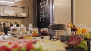 a kitchen with a bunch of food on a counter at Good Morning Bologna in Bologna +80 photos
