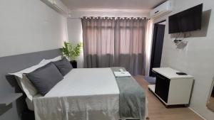 Säng eller sängar i ett rum på Hotel e Restaurante do Baixinho