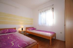 Postel nebo postele na pokoji v ubytování Apartment Ruzmarin