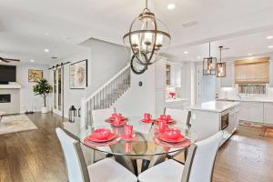 a kitchen and dining room with a glass table and chairs at The haven @ Roc Sac in Rocklin