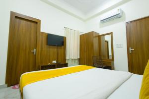 Un ou plusieurs lits dans un hébergement de l'établissement Hotel Superhouse by Wisdom Madhav