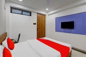 Una cama o camas en una habitación de Flagship Hotel Gold Mine
