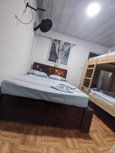 Säng eller sängar i ett rum på Apartamento Playa Juanchaco