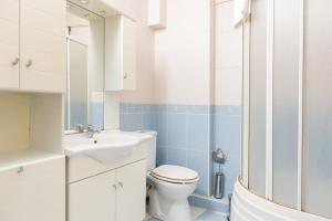 a bathroom with a toilet and a sink and a shower at Big Family Apart in Istanbul