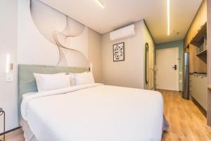 Кровать или кровати в номере Charlie Domy Paraíso