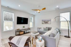 a living room with a couch and a tv at Luxe Wilmington Home 2 Mi to Historic Downtown in Wilmington